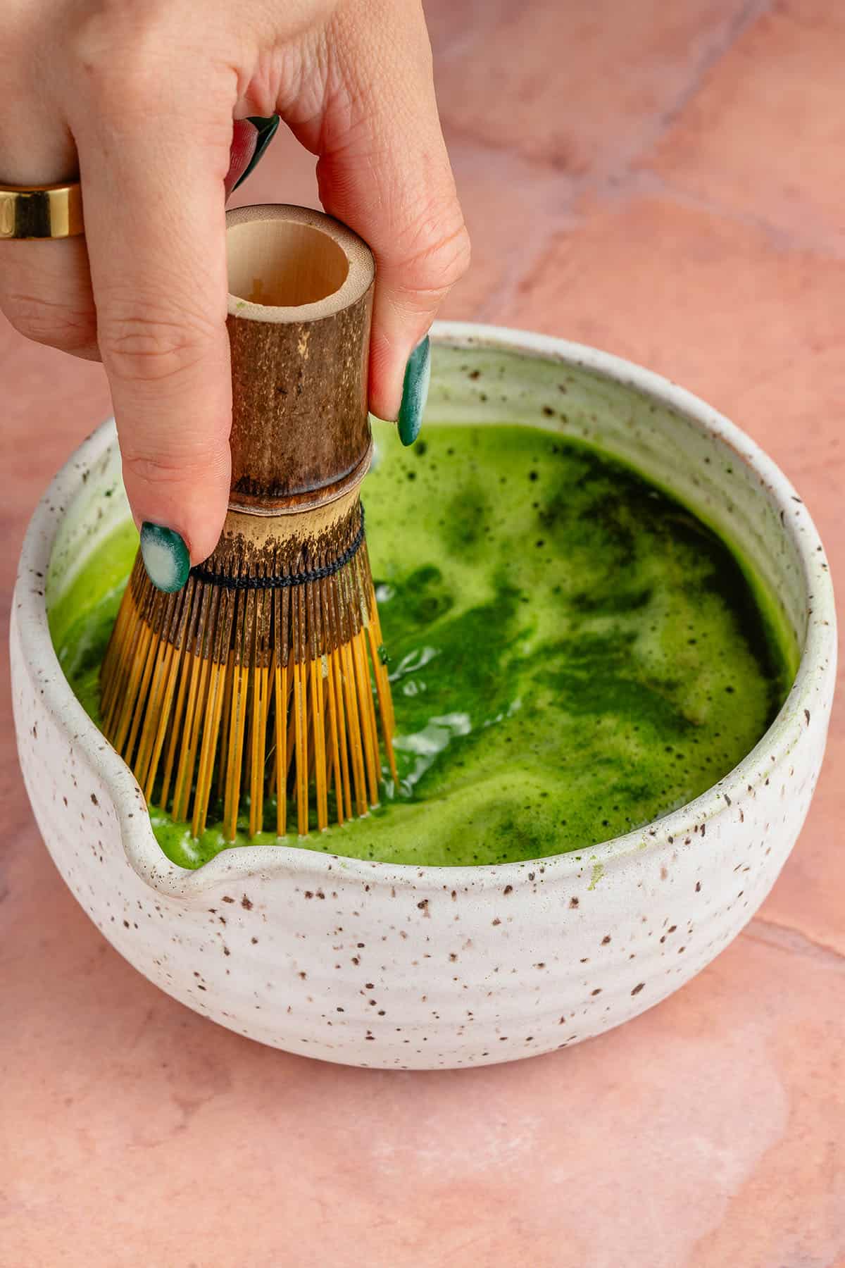 using chasen to whisk matcha and how water in white bowl