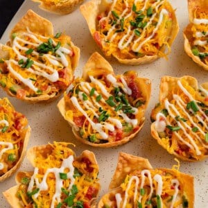 jalapeno popper cups lined on white plate