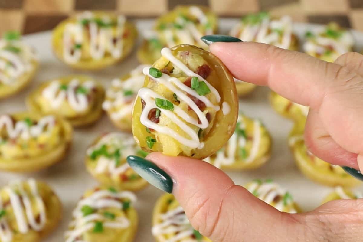 mini twice baked potato held in fingers