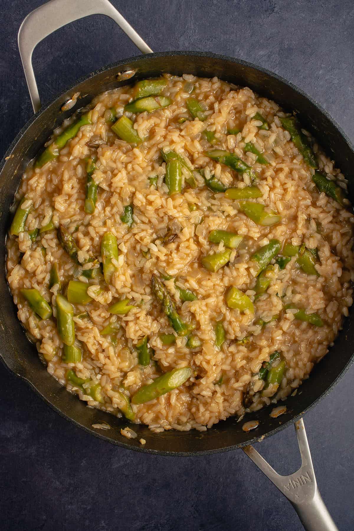 a pan filled with asparagus risotto