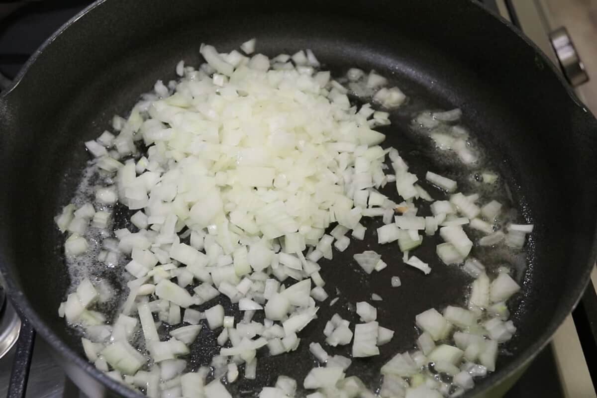 onions being added to melted vegan butter