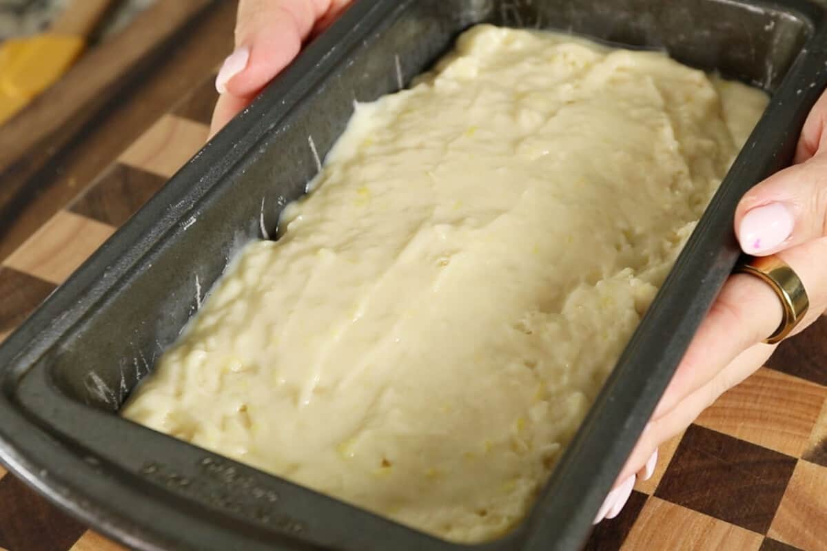 unbaked vegan lemon loaf batter in metal baking pan
