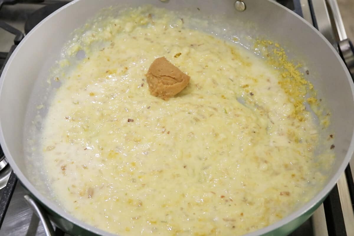 step by step: adding miso paste to cream sauce