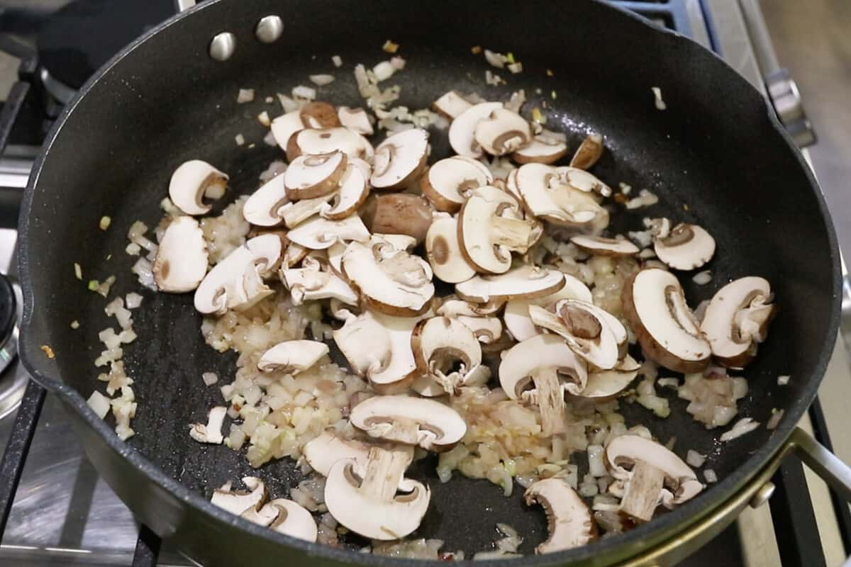 step by step - adding mushrooms to the pan