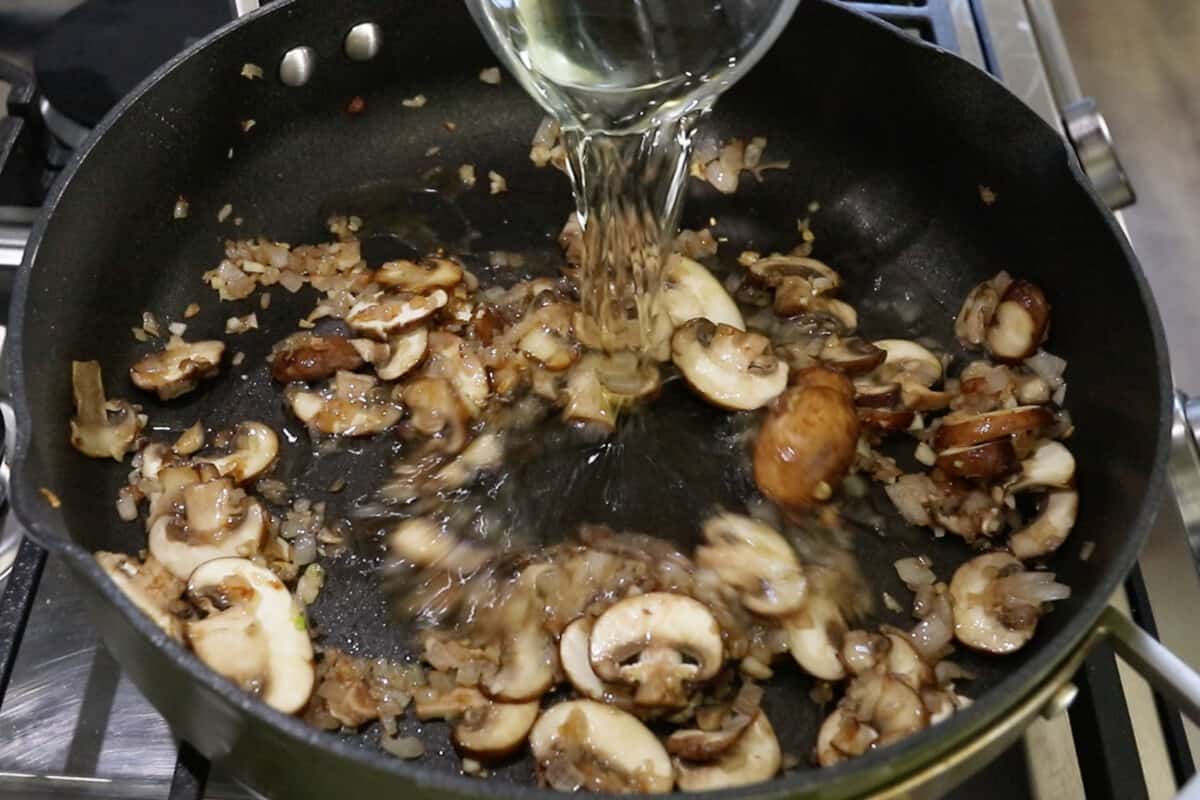 step by step - adding white wine to the pan