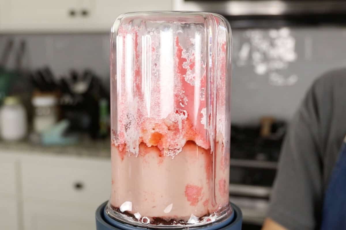 making vegan strawberry mousse in our place blender