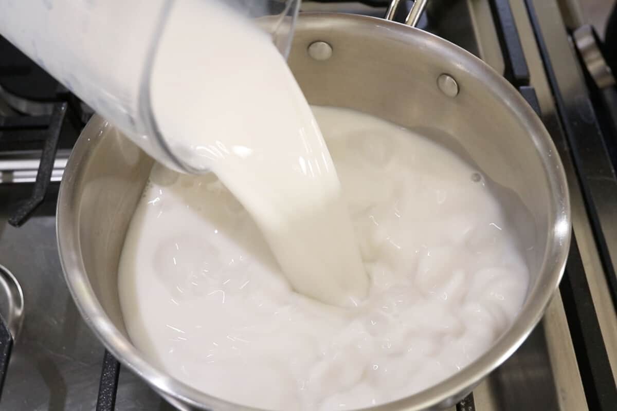 step by step - pouring non-dairy milk into sauce pan