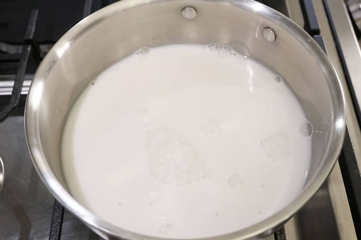 step by step - evaporated milk starting to boil in sauce pan