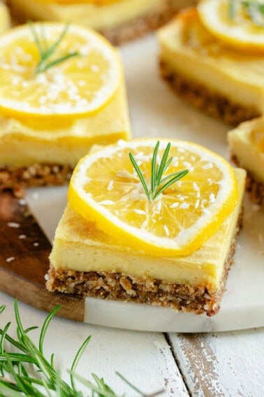 slices of vegan lemon bars on white marble board