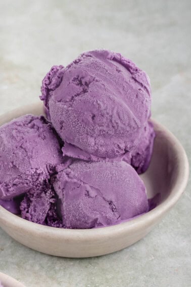 photo of scoops of purple ube ice cream in small grey bowl