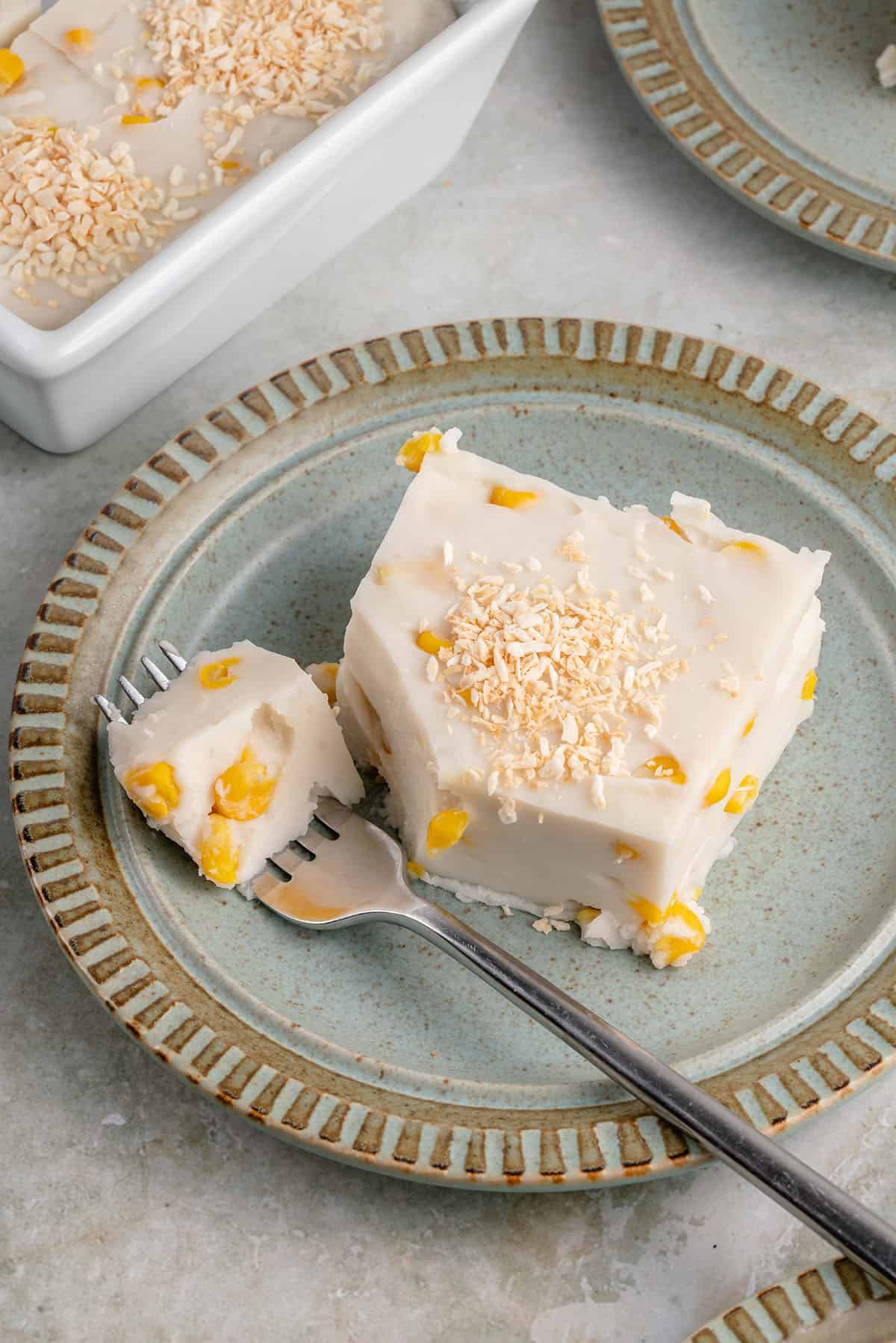 a slice of maja blanca and a fork