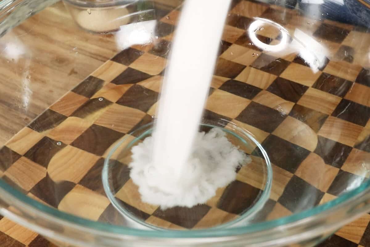 step by step - adding sugar into large bowl with warm water