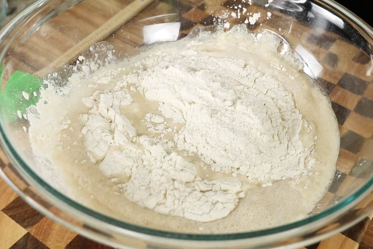 step by step - adding flour to a large bowl
