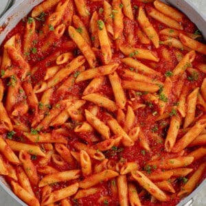 close up photo of Penne All'Arrabbiata (Spicy Tomato Pasta) in large skillet