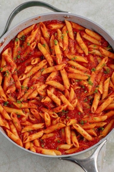 close up photo of Penne All'Arrabbiata (Spicy Tomato Pasta) in large skillet