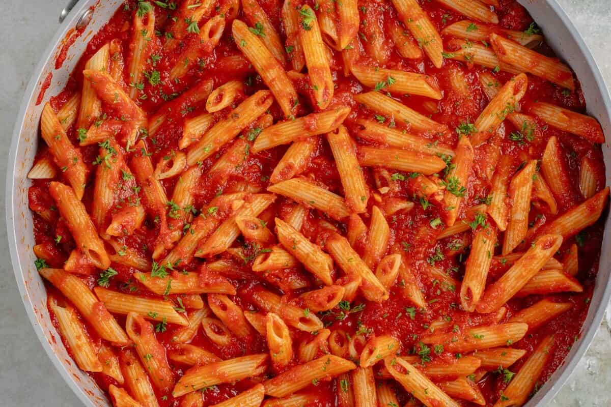 close up photo of Penne All'Arrabbiata (Spicy Tomato Pasta) in large skillet