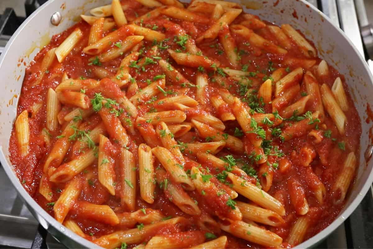 close up photo of Penne All'Arrabbiata (Spicy Tomato Pasta) in large skillet