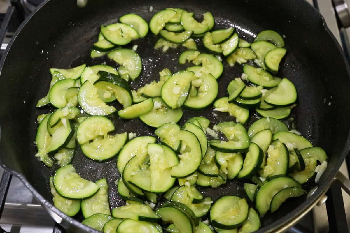 sautéing zucchini in a pan