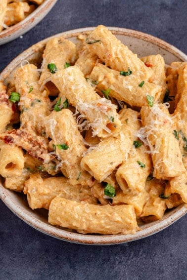 bowl of marry me pasta with dairy-free parm and herbs on top