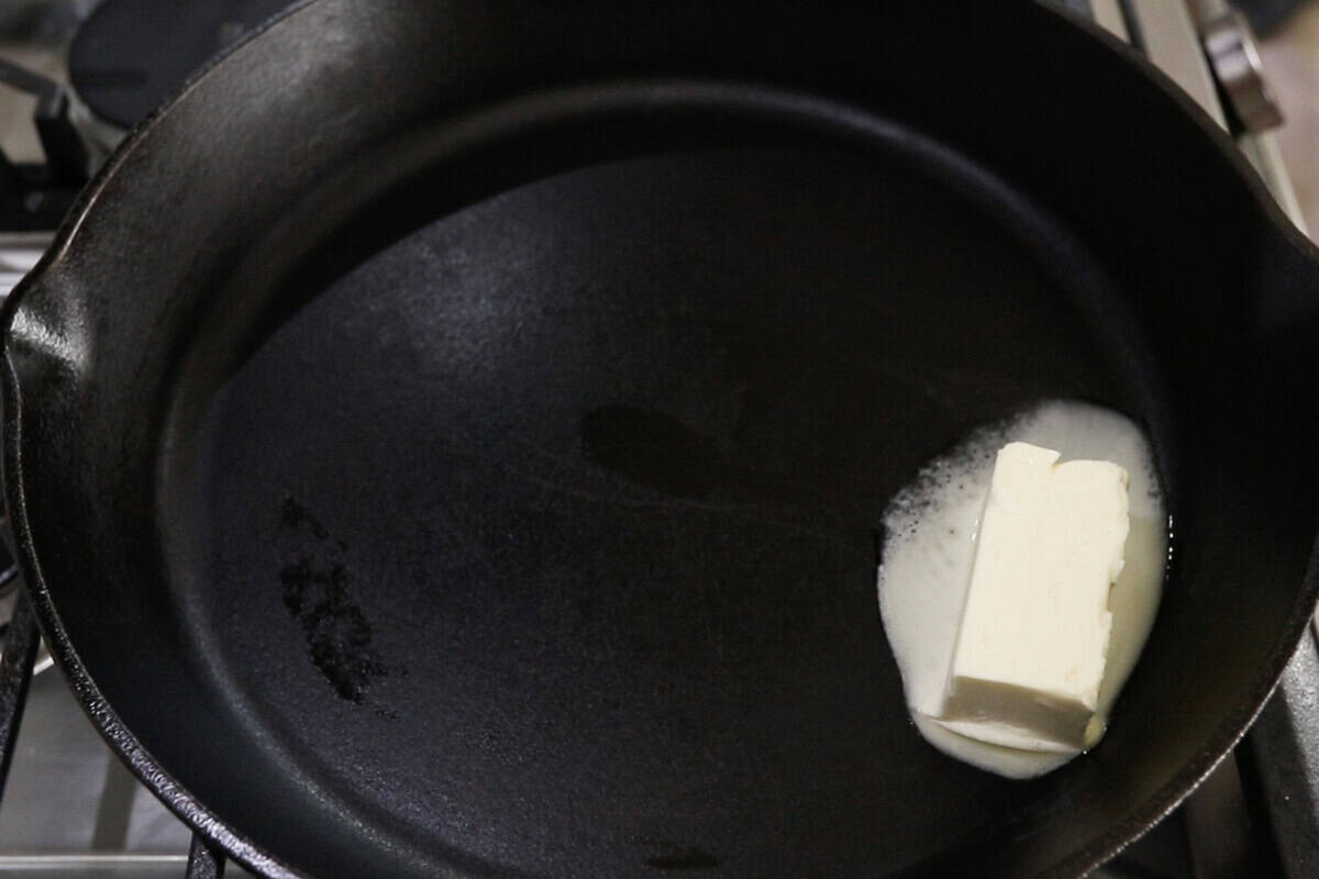 step by step: melting butter in a cast iron skillet