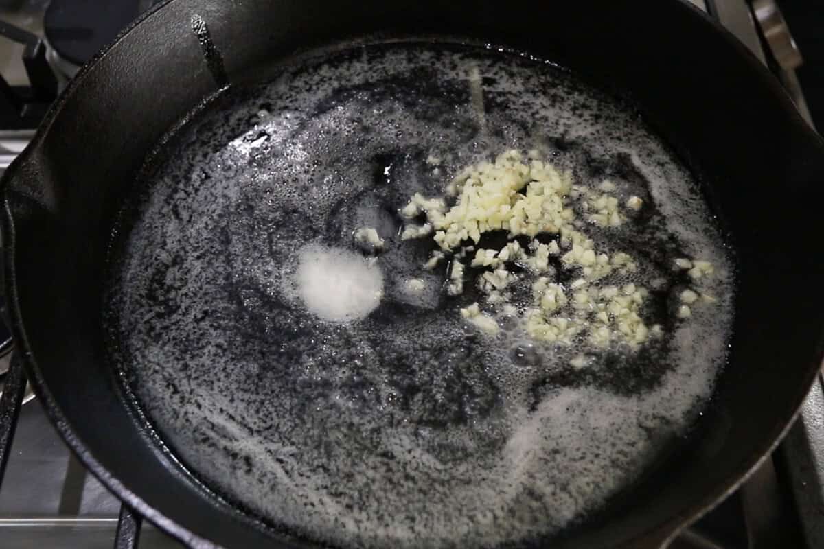 step by step: adding garlic to the melted butter