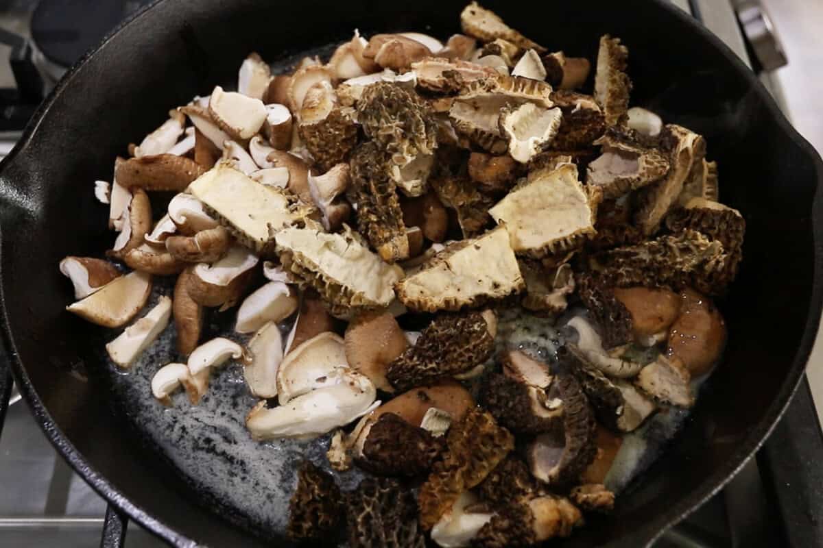 step by step: adding the mushrooms to the pan