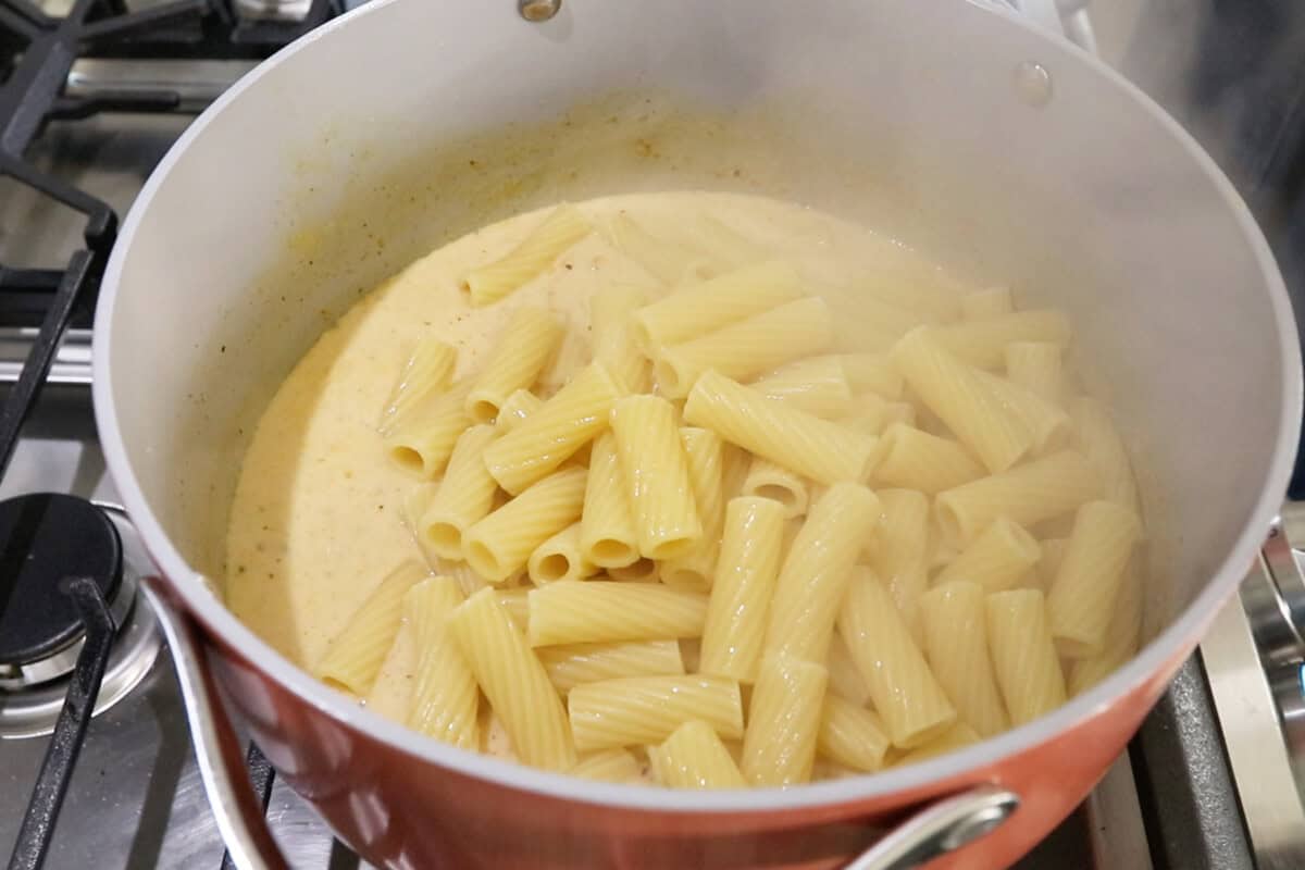 step by step: adding the cooked pasta into the cream sauce