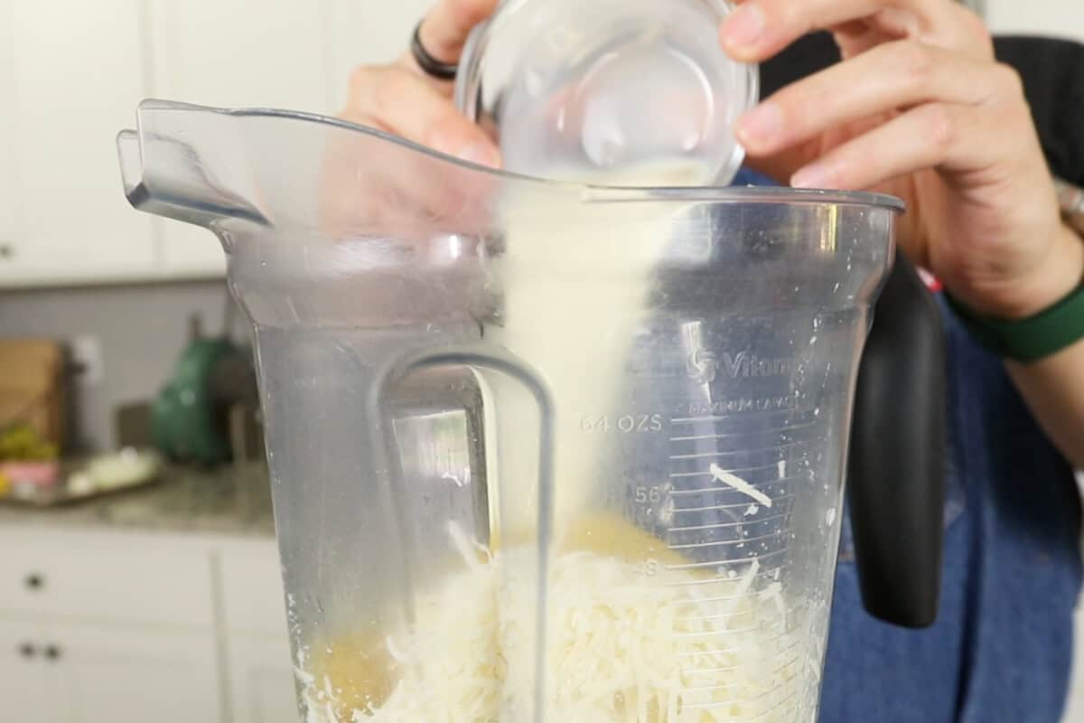 making creamy non-dairy sauce for Vegan Spinach Artichoke Pasta