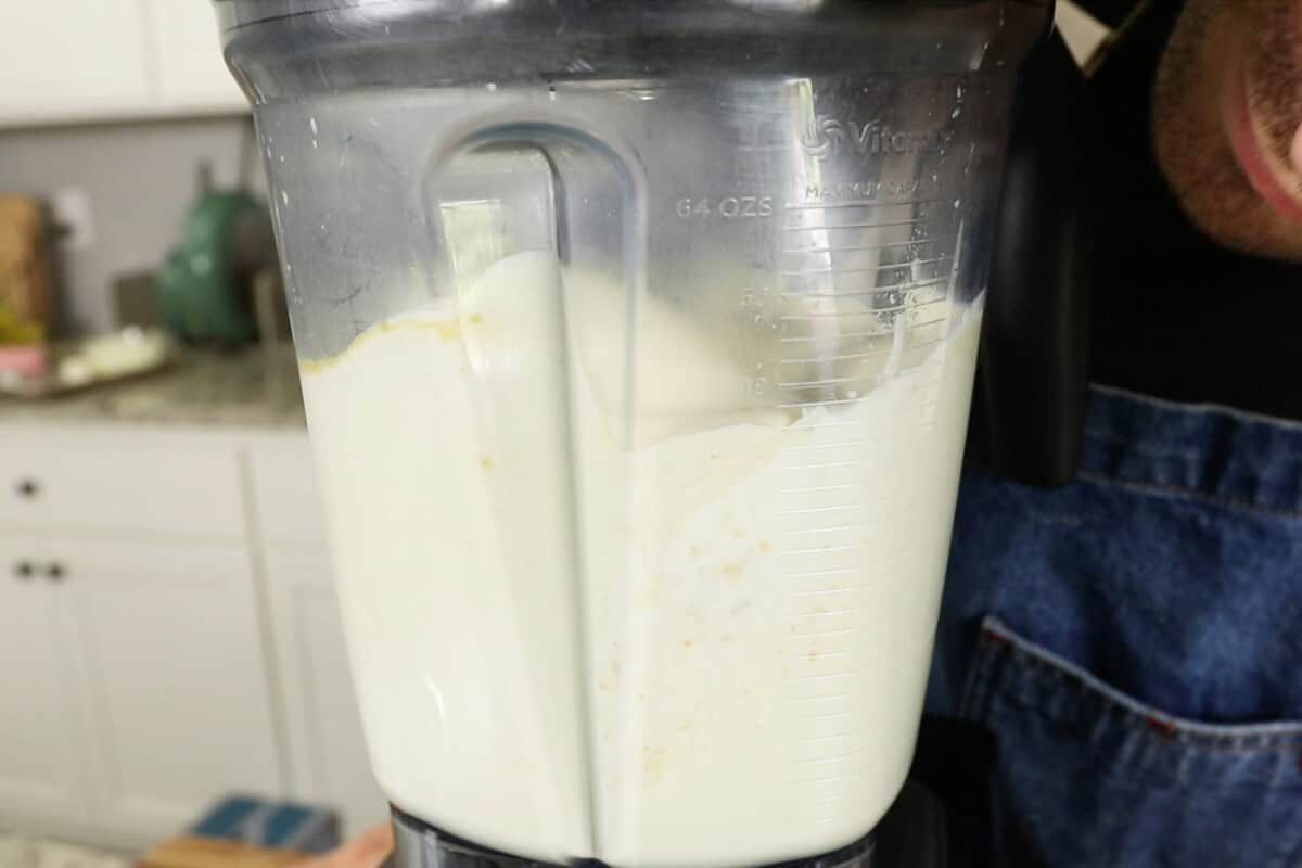 making creamy non-dairy sauce for Vegan Spinach Artichoke Pasta in vitamix blender