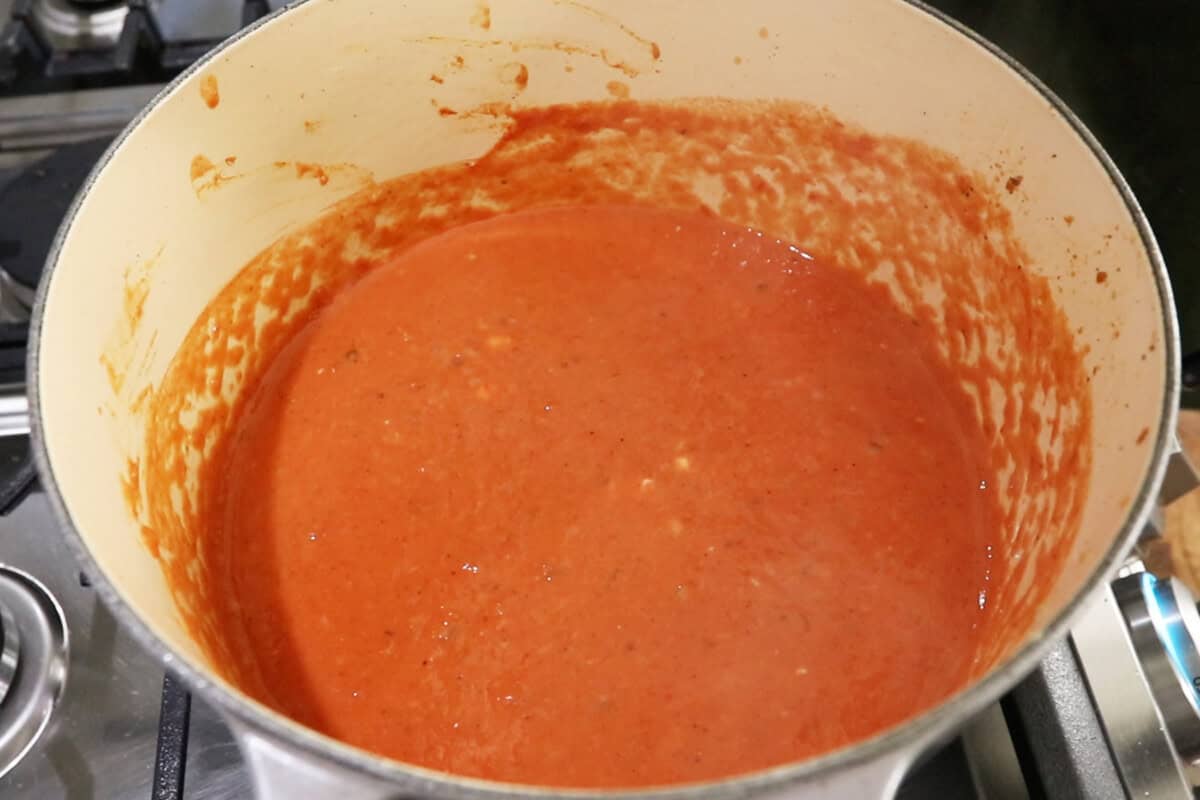 creamy vegan cajun pasta sauce in large Dutch oven