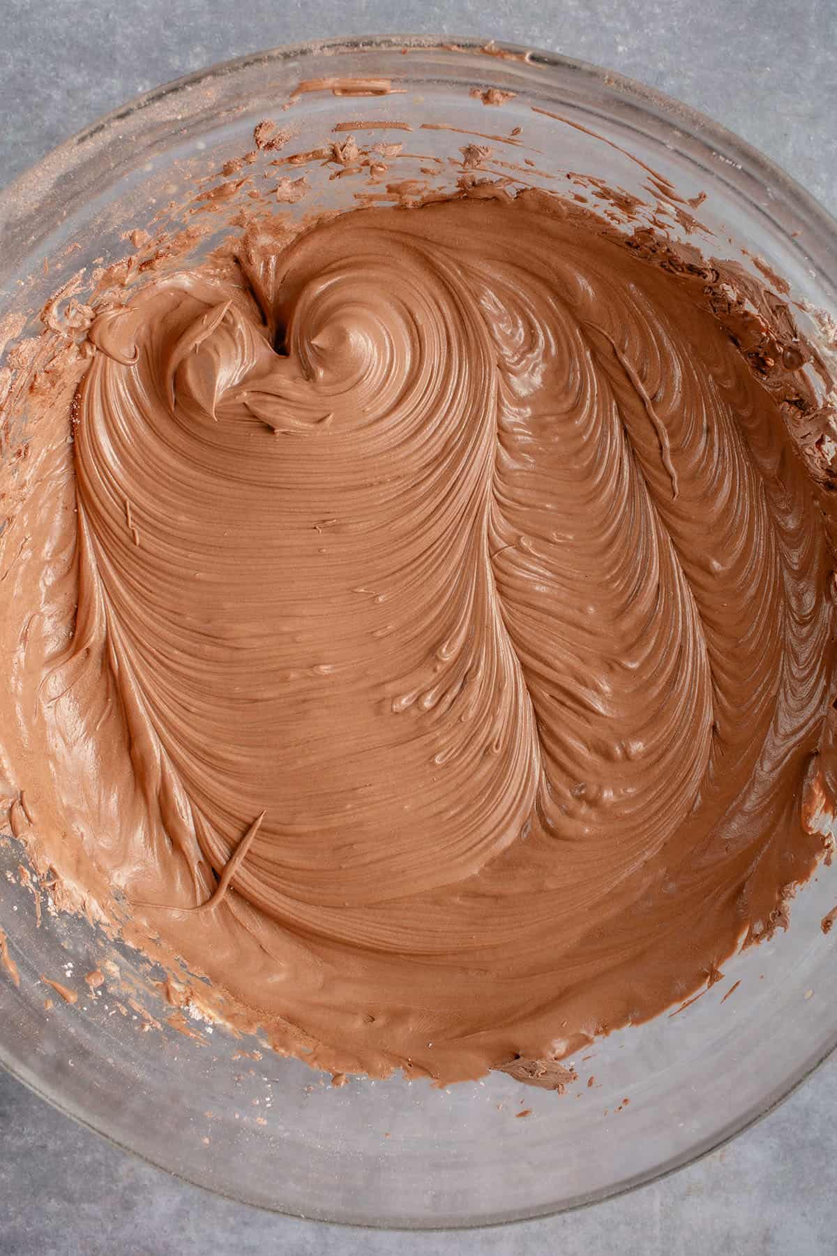 a large bowl of chocolate buttercream frosting