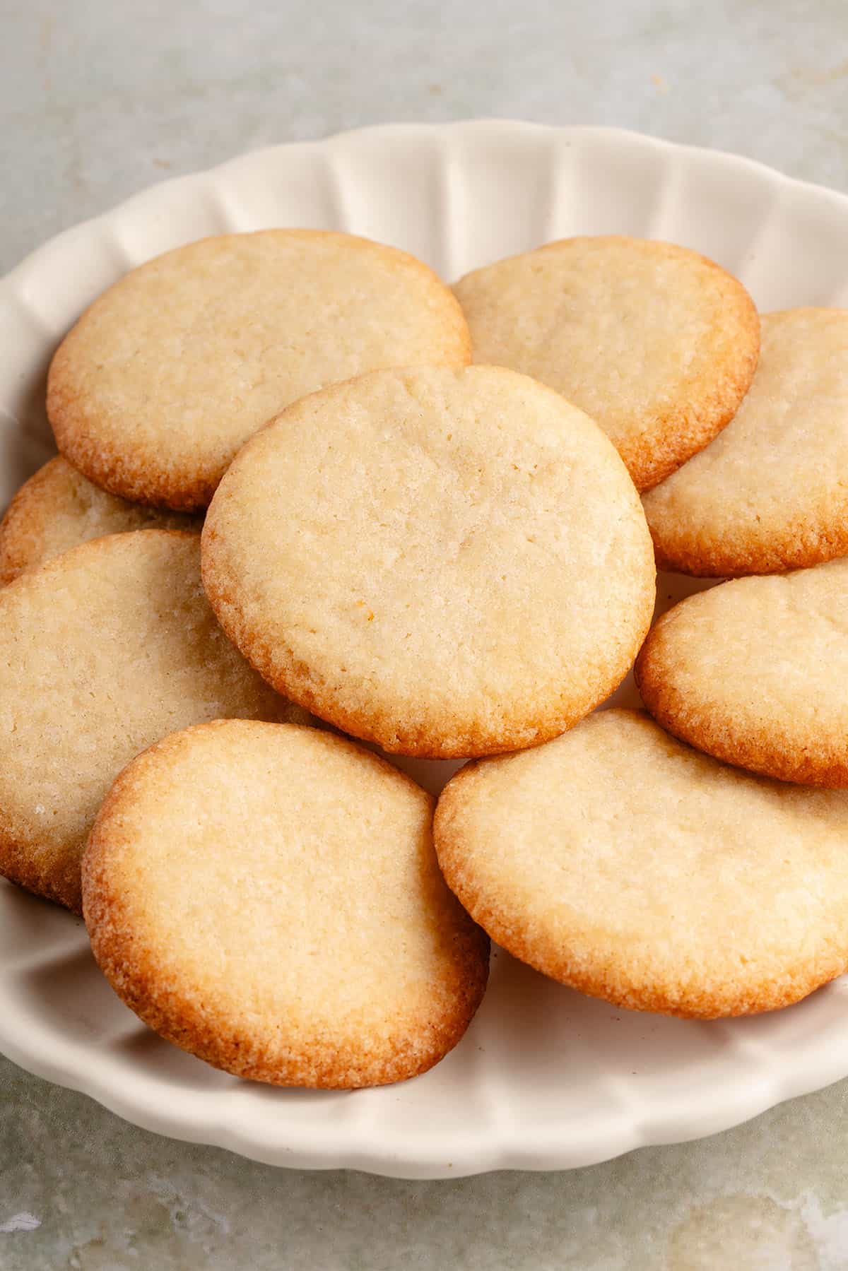 white plate piled with vegan vanilla wafers