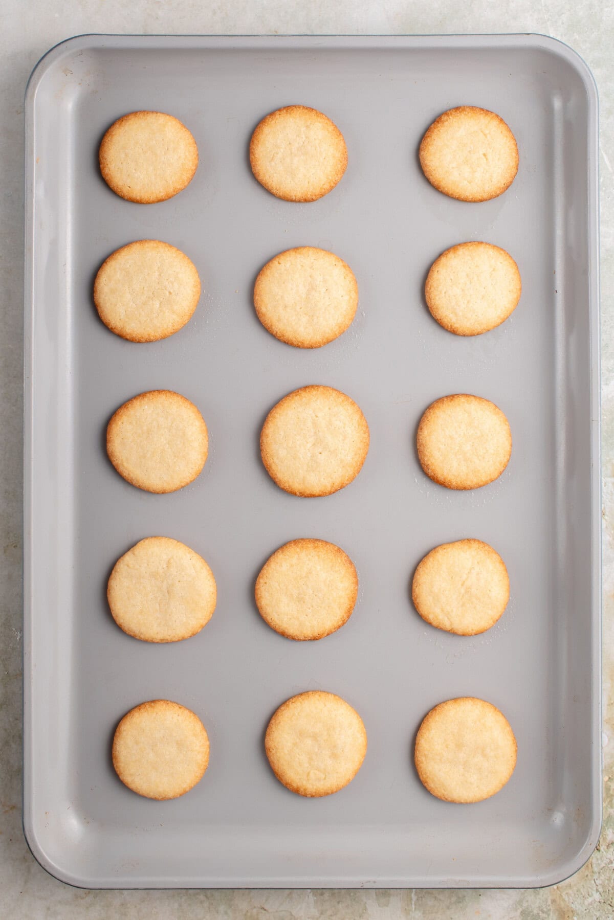 baked vegan vanilla wafers on a cookie sheet