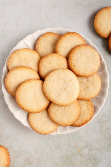 vegan vanilla wafers piled on a white plate