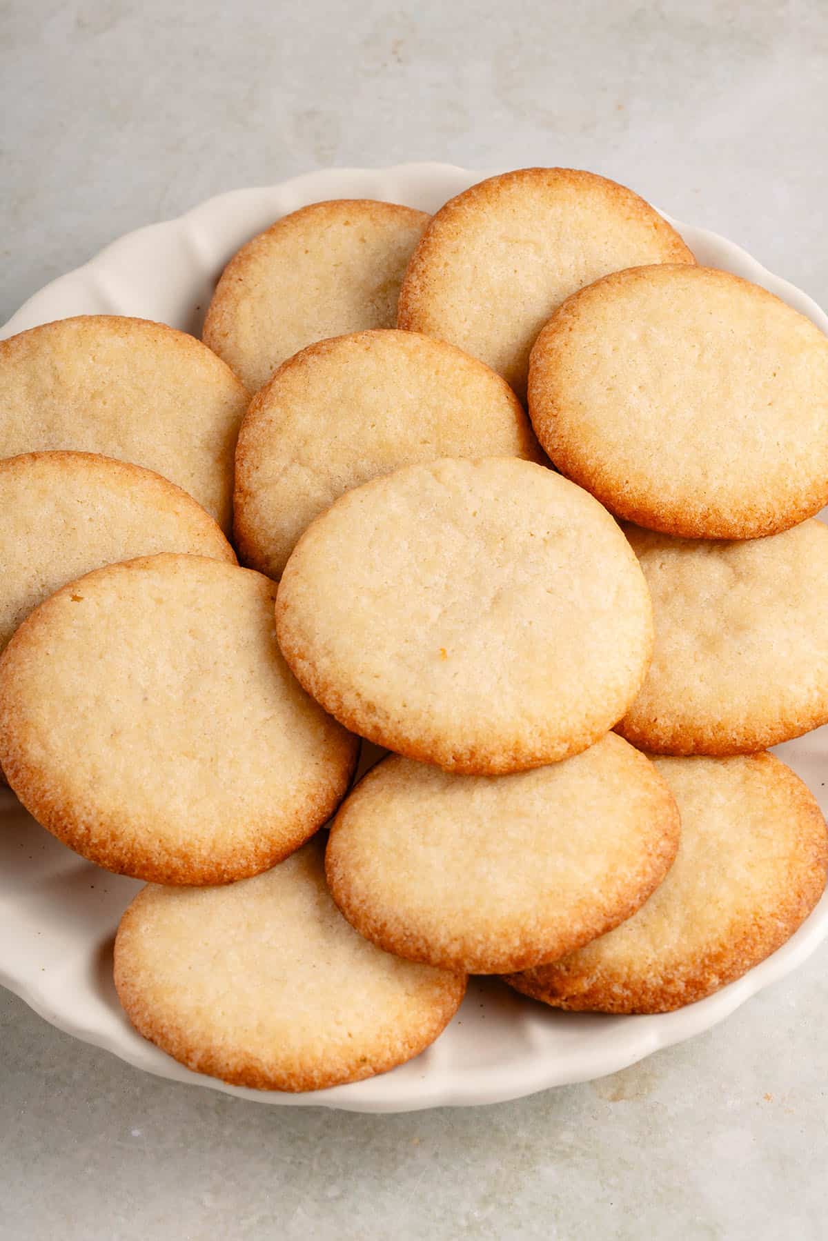 vegan vanilla wafers piled on white plate