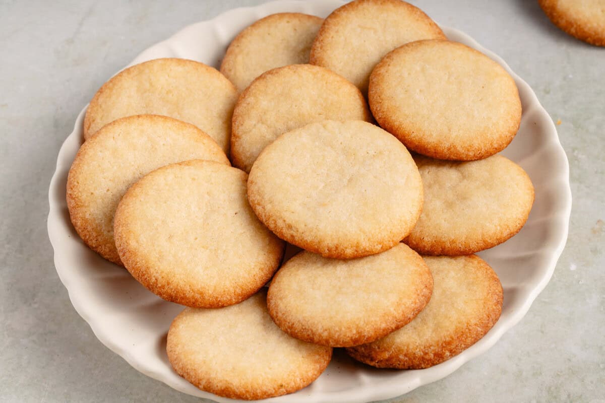 vegan vanilla wafers piled on white plate