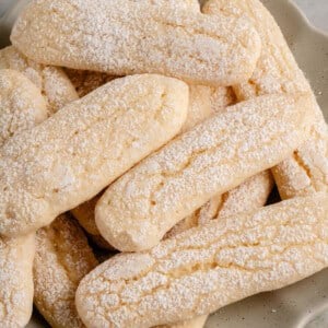 pile of vegan ladyfingers on a white plate