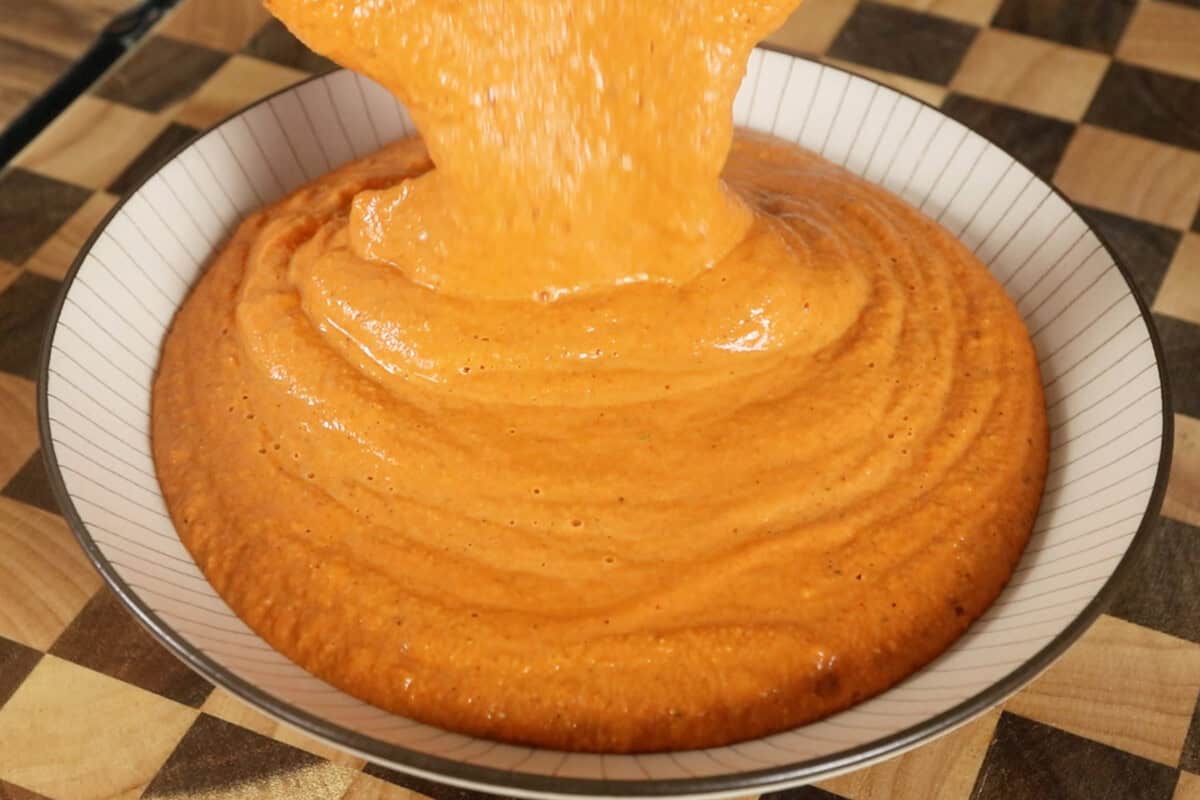 pouring sauce into a bowl