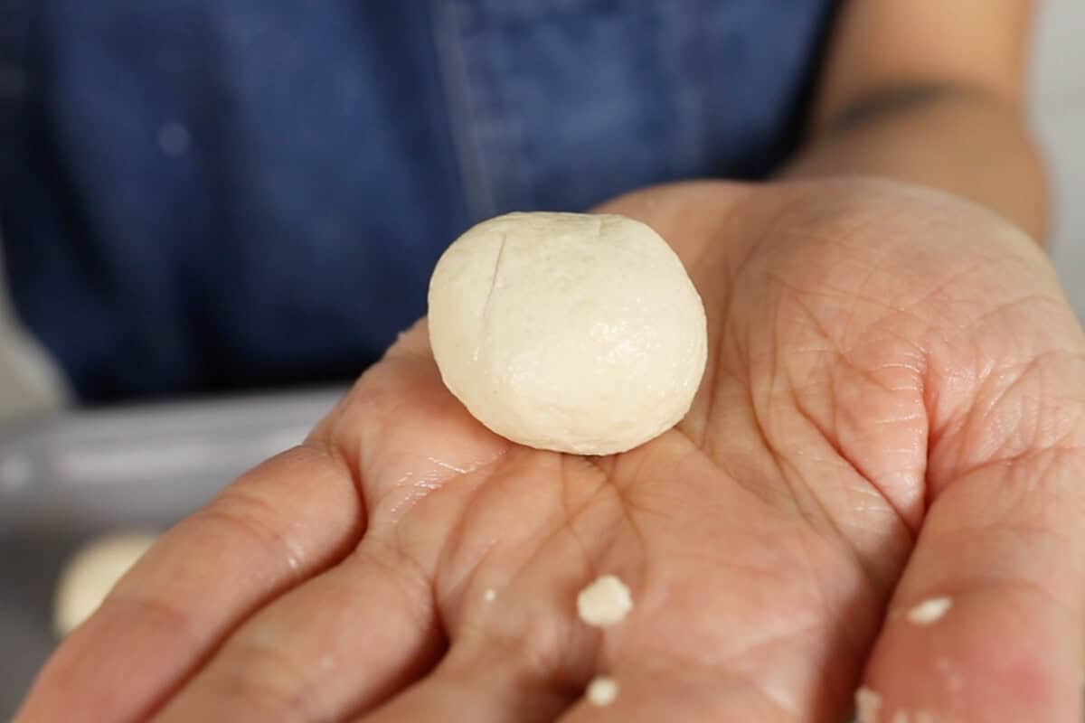 step by step: rolling dough into a ball with hands