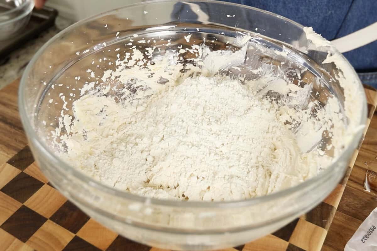 step by step: adding flour to large bowl