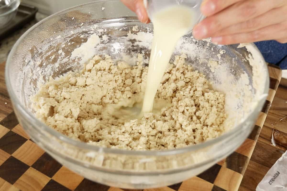 step by step: adding non-dairy milk to the bowl