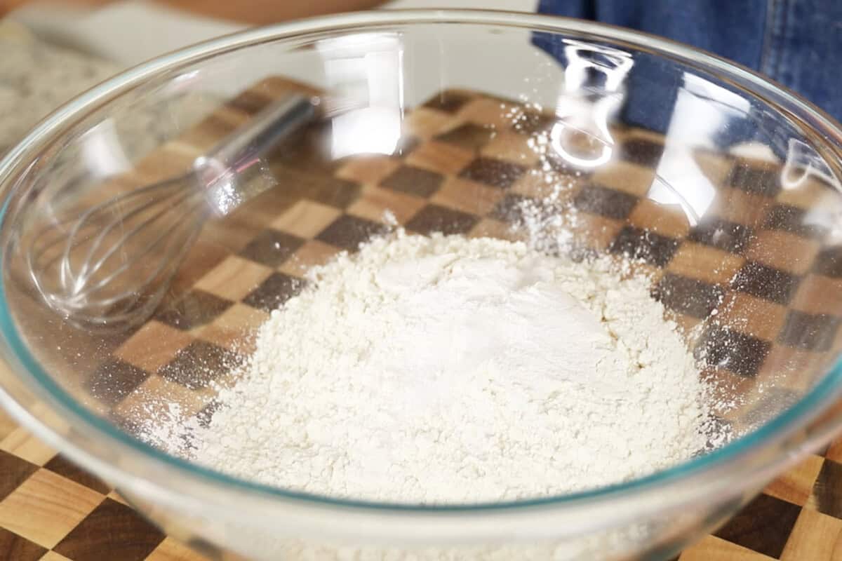 step by step: adding flour to a large glass bowl