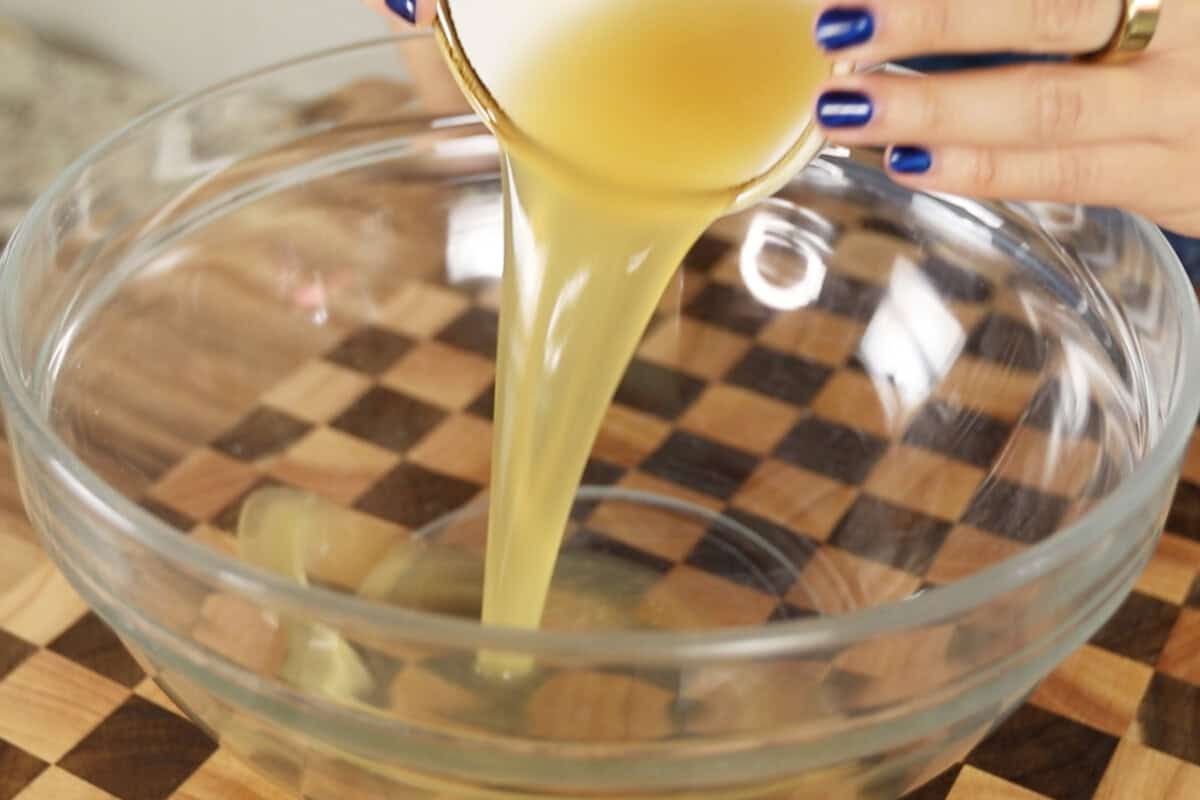 step by step: adding aquafaba to glass bowl