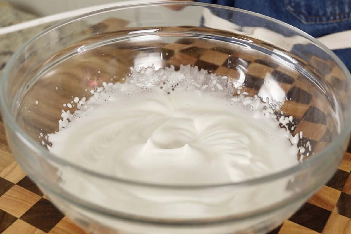 step by step: whipped aquafaba in a bowl