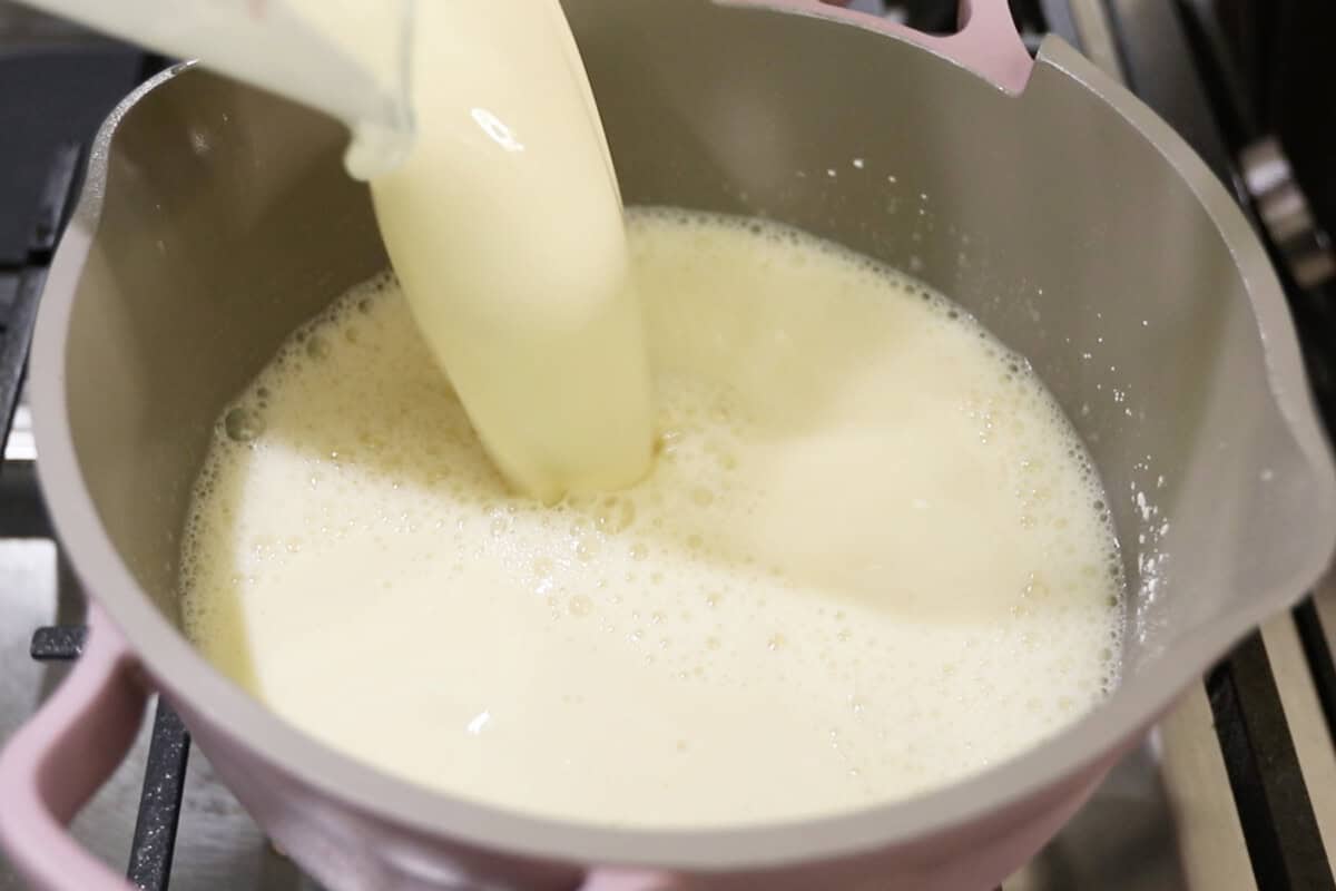 preparing vegan vanilla custard in a small pan