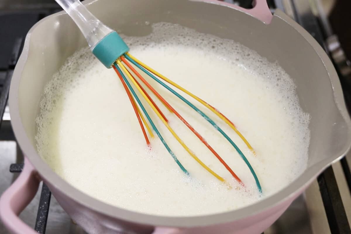 preparing vegan vanilla custard in a small pan