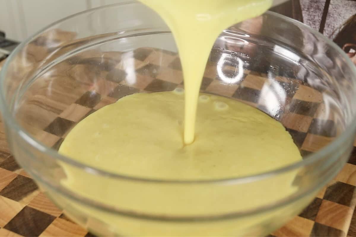 preparing vegan vanilla custard in glass bowl