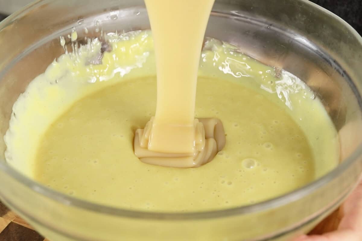 preparing vegan vanilla custard in glass bowl