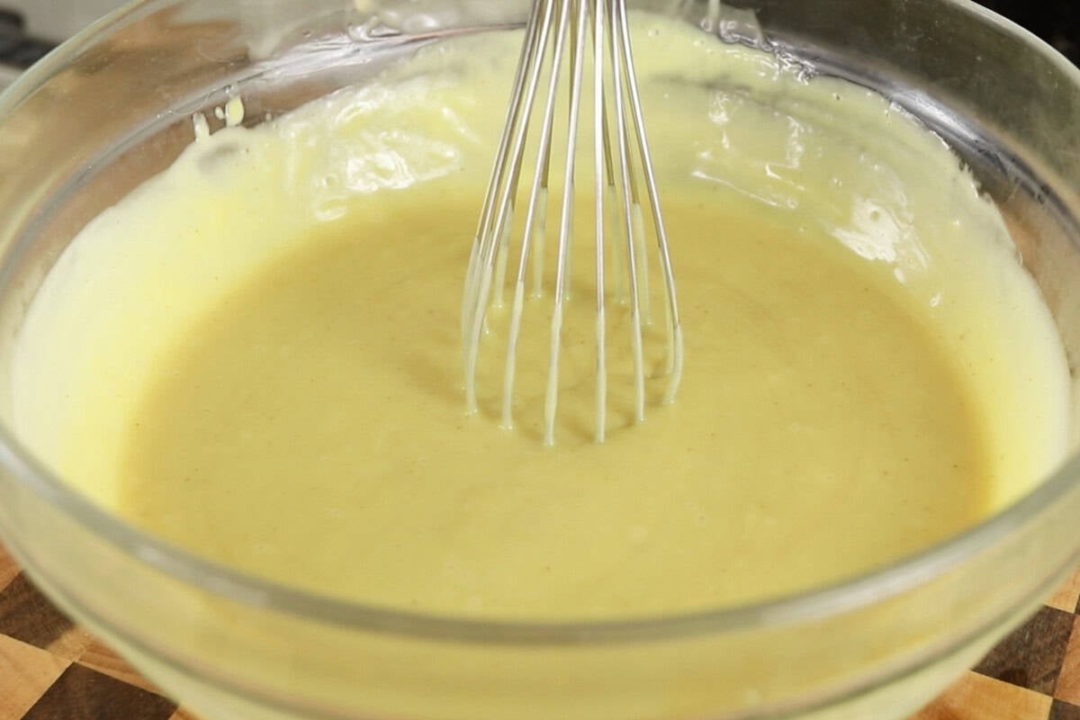 preparing vegan vanilla custard in glass bowl