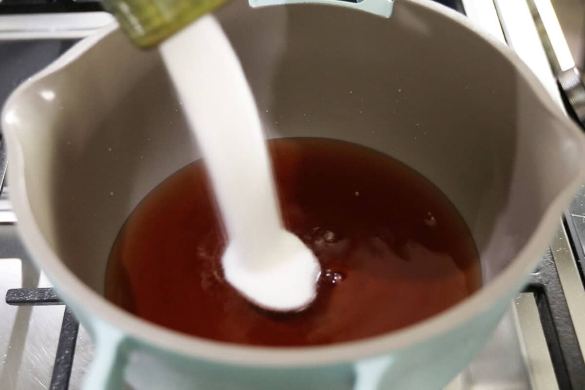 adding sugar to the pot